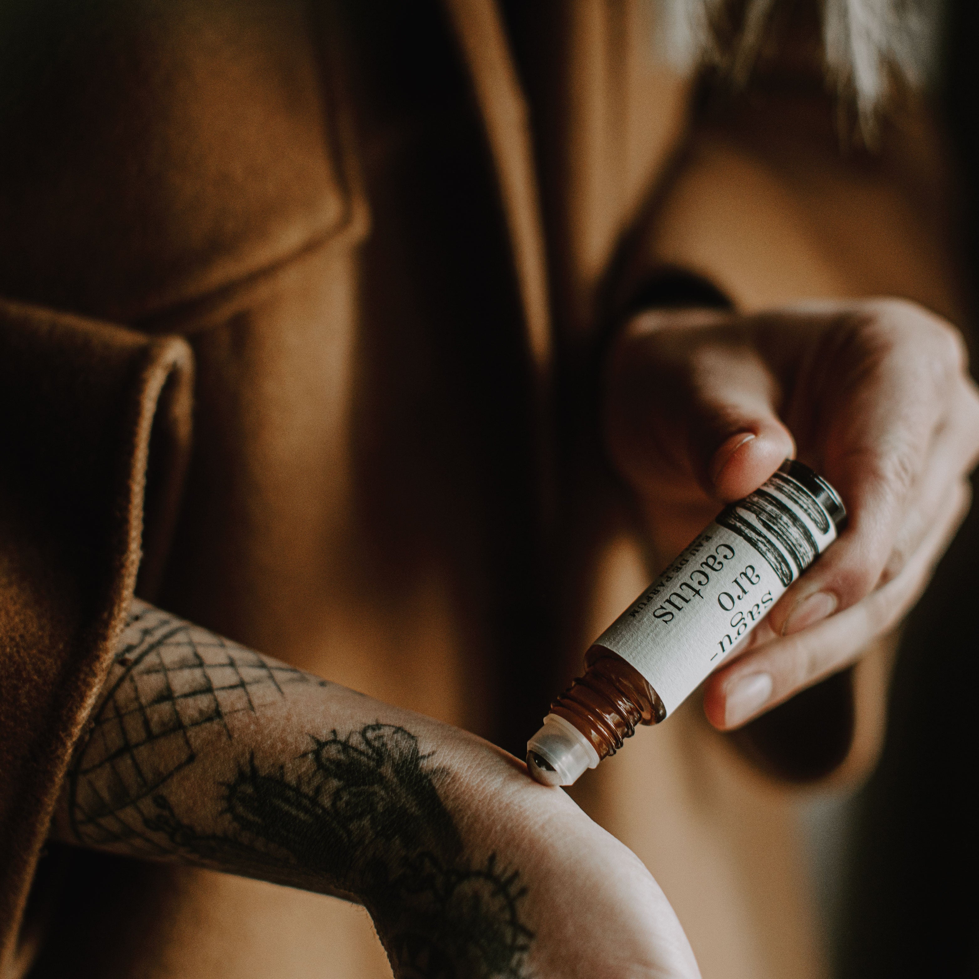 Saguaro Cactus Roll-On Perfume being applied to a wrist.