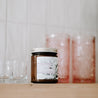 9oz Dusty Jasmine Soy Candle on kitchen shelf. 