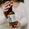 8oz Saguaro Cactus Body Lotion being held by two hands. 