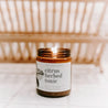 9oz Citrus Herbed Tonic Soy Candle on white countertop. 