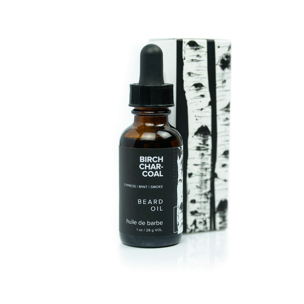 1oz Birch Charcoal Beard Oil on white background. 