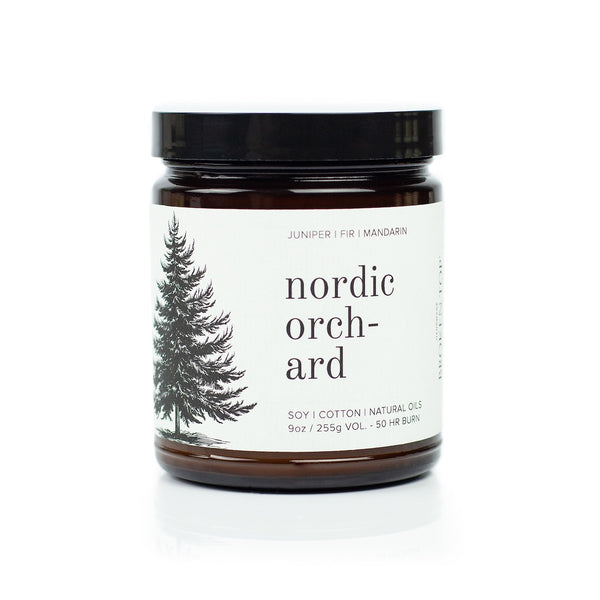 9oz Nordic Orchard Soy Candle on white background. 