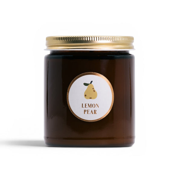 Brown jar with gold lid and 'Lemon Pear' label on a white background