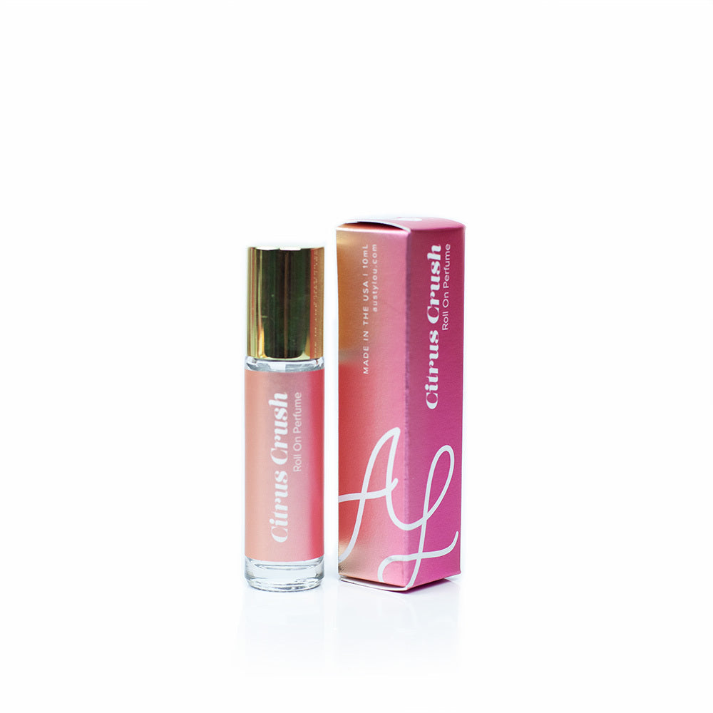 Austy Lou Citrus Crush Roll-On Perfume on white background. 