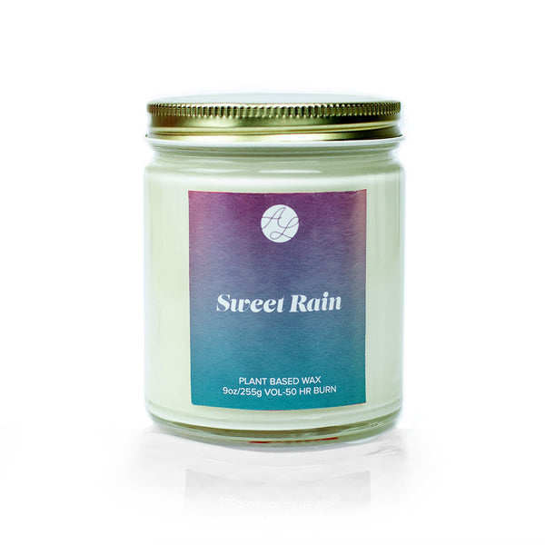 9oz Austy Lou Sweet Rain Soy Candle on white background. 