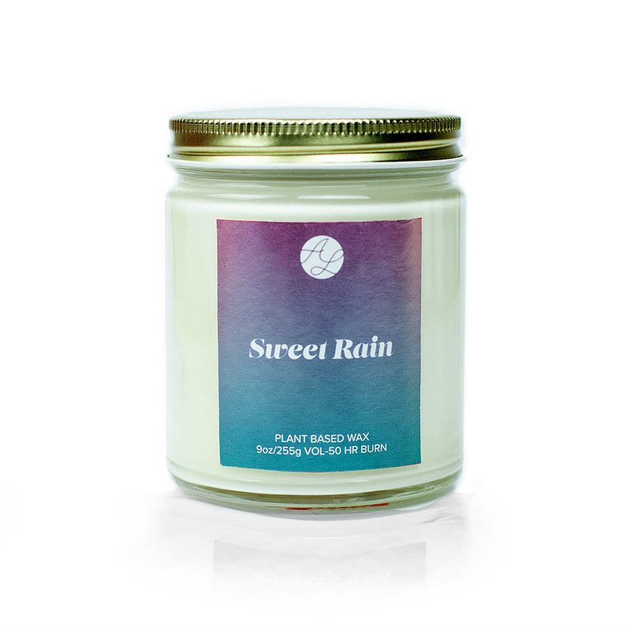 9oz Austy Lou Sweet Rain Soy Candle on white background. 