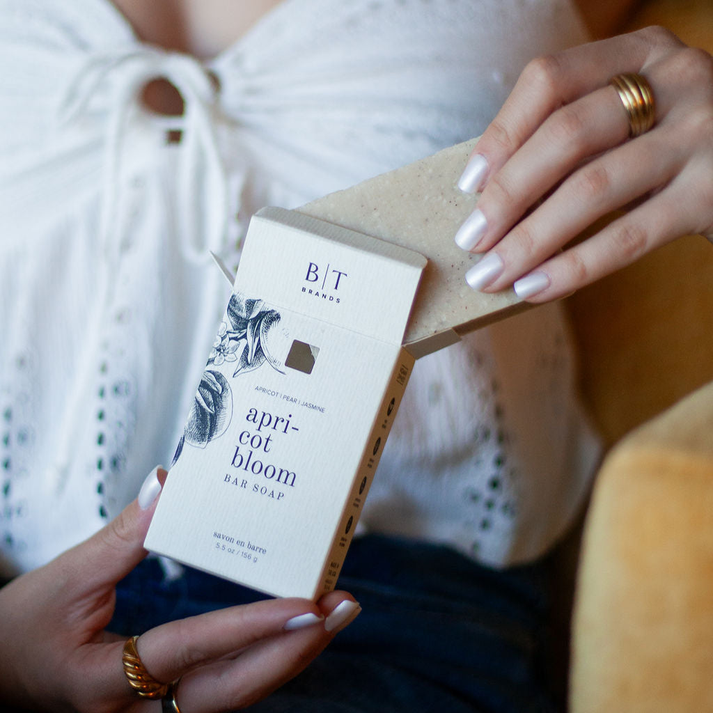Apricot Bloom Bar Soap being unboxed. 