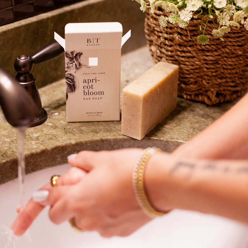 Apricot Bloom Bar Soap on bathroom sink countertop.  