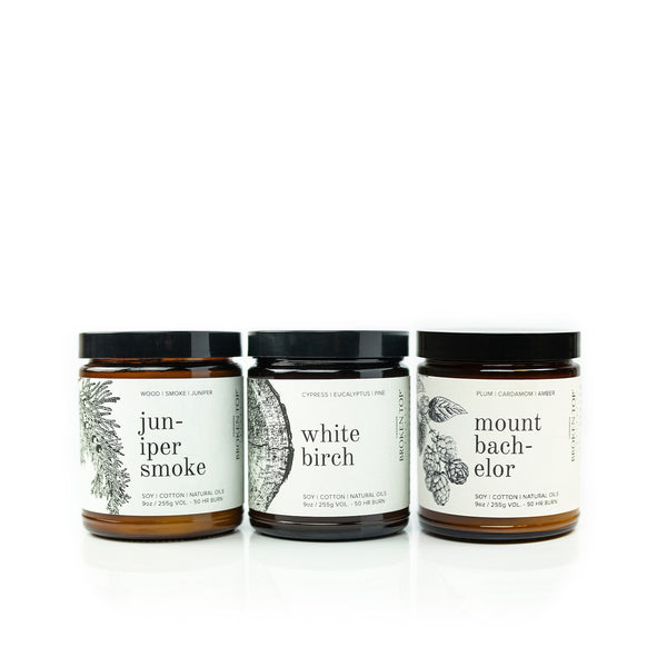 Juniper Smoke 9oz Soy Candle, White Birch 9oz Soy Candle and Mount Bachelor 9oz Soy Candle on white background. 