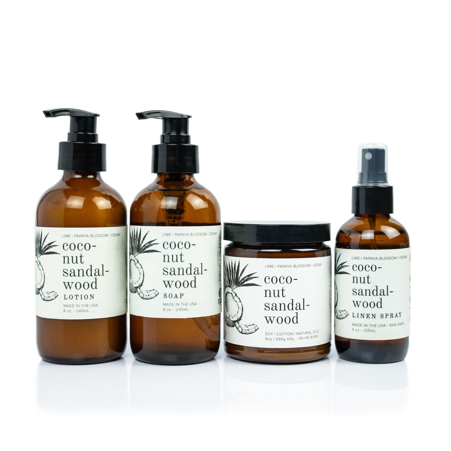 Coconut Sandalwood Bundle including 8oz Coconut Sandalwood Body Lotion, 8oz Coconut Sandalwood Liquid Soap, 9oz Coconut Sandalwood Soy Candle, and 4oz Coconut Sandalwood Linen Spray on white background. 
