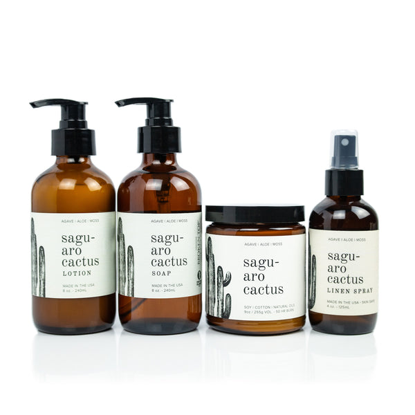 Saguaro Cactus Bundle including 8oz Saguaro Cactus Body Lotion, 8oz Saguaro Cactus Liquid Soap, 9oz Saguaro Cactus Soy Candle, and 4oz Saguaro Cactus Linen Spray on white background. 