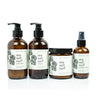 Sea Salt Surf Bundle including 8oz Sea Salt Surf Body Lotion, 8oz Sea Salt Surf Liquid Soap, 9oz Sea Salt Surf Soy Candle, and 4oz Sea Salt Surf Linen Spray on white background. 