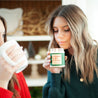 'Naughty, Nice, I'm Fun' 9oz Soy Candle being smelled by a young woman. 