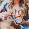 9oz Fresh Squeezed Soy Candle being lit by a match. 