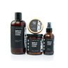 Birch Charcoal Bundle including 16oz Birch Charcoal Body Wash, Birch Charcoal Solid Cologne, 9oz Birch Charcoal Soy Candle, and 4oz Birch Charcoal Man Spray on white background. 