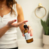 8oz Fresh Squeezed Body Lotion being dispensed into a hand by a woman. 