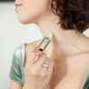 Austy Lou Vanilla Sky Roll-On-Perfume being applied to a woman's neck. 