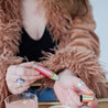 Austy Lou Citrus Crush Roll-On Perfume being applied to a woman's wrist. 