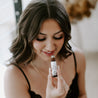 Lavender Mint Roll-On Perfume being smelled by a woman. 