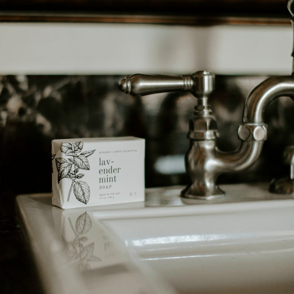 Lavender Mint Bar Soap next to bathroom sink. 