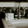 Lavender Mint Bar Soap next to bathroom sink. 