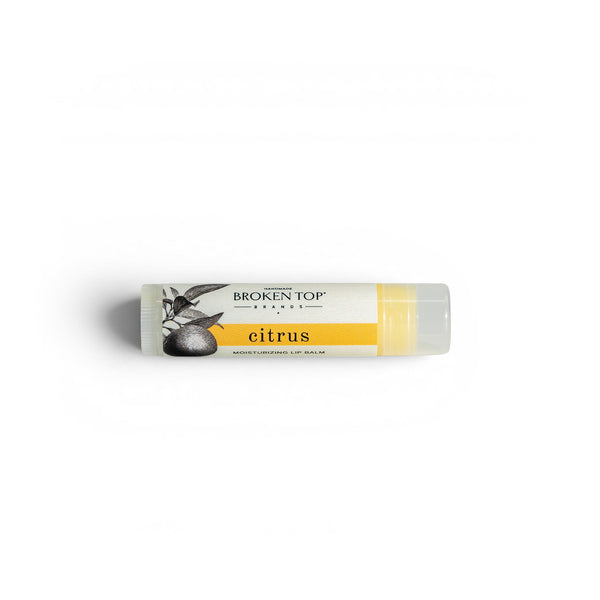 A tube of Citrus Lip Balm on a white background. 