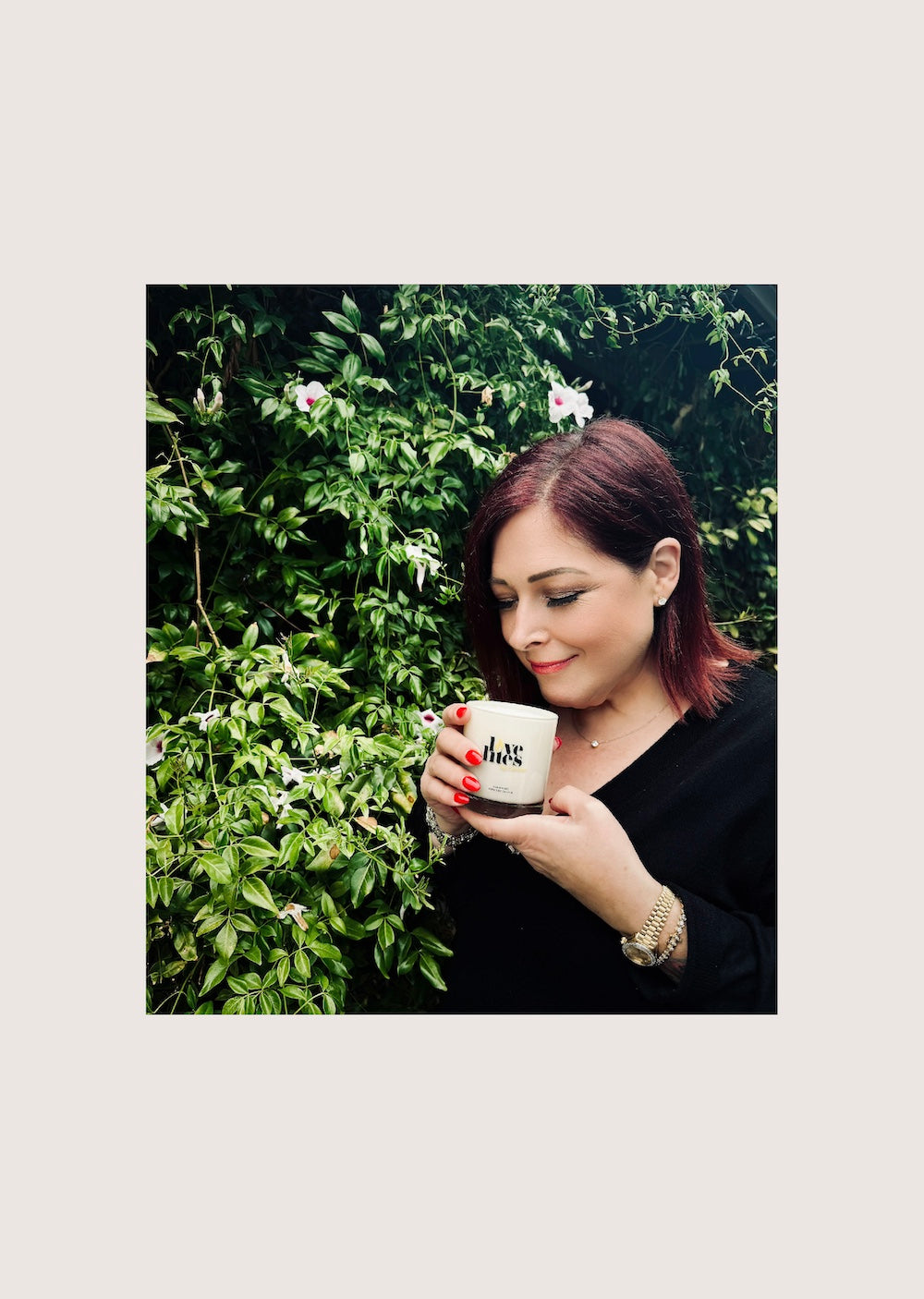 Carnie Wilson holding a Love Lites by Carnie Wilson Soy Candle. 