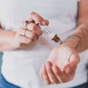 Mount Bachelor Roll-On Perfume being applied to a wrist. 