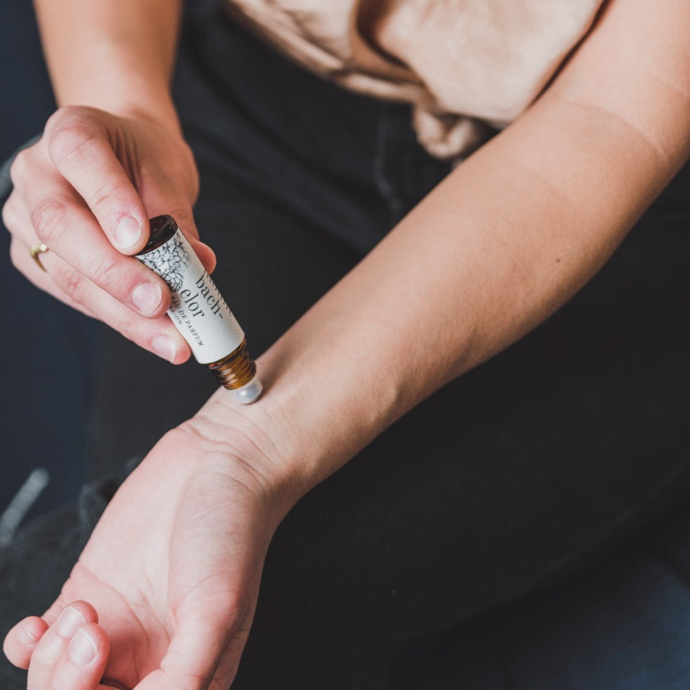 Mount Bachelor Roll-On Perfume being applied to a wrist. 
