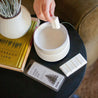 Nordic Orchard Wax Melt being placed in a white wax melter. 