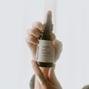 4oz Saguaro Cactus Linen Spray being held by two hands. 