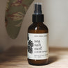 4oz Sea Salt Surf Linen Spray on a wooden bench. 
