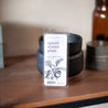 Spiced Winter Plum Soy Wax Melt on wooden table in front of a black wax melter. 