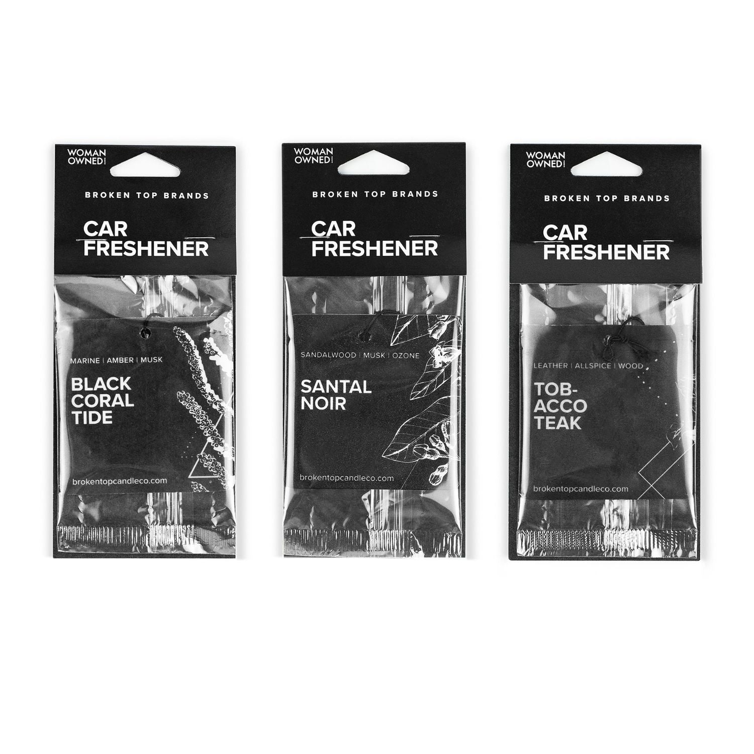 Black Coral Tide, Santal Noir, and Tobacco Teak Car Fresheners on white background. 