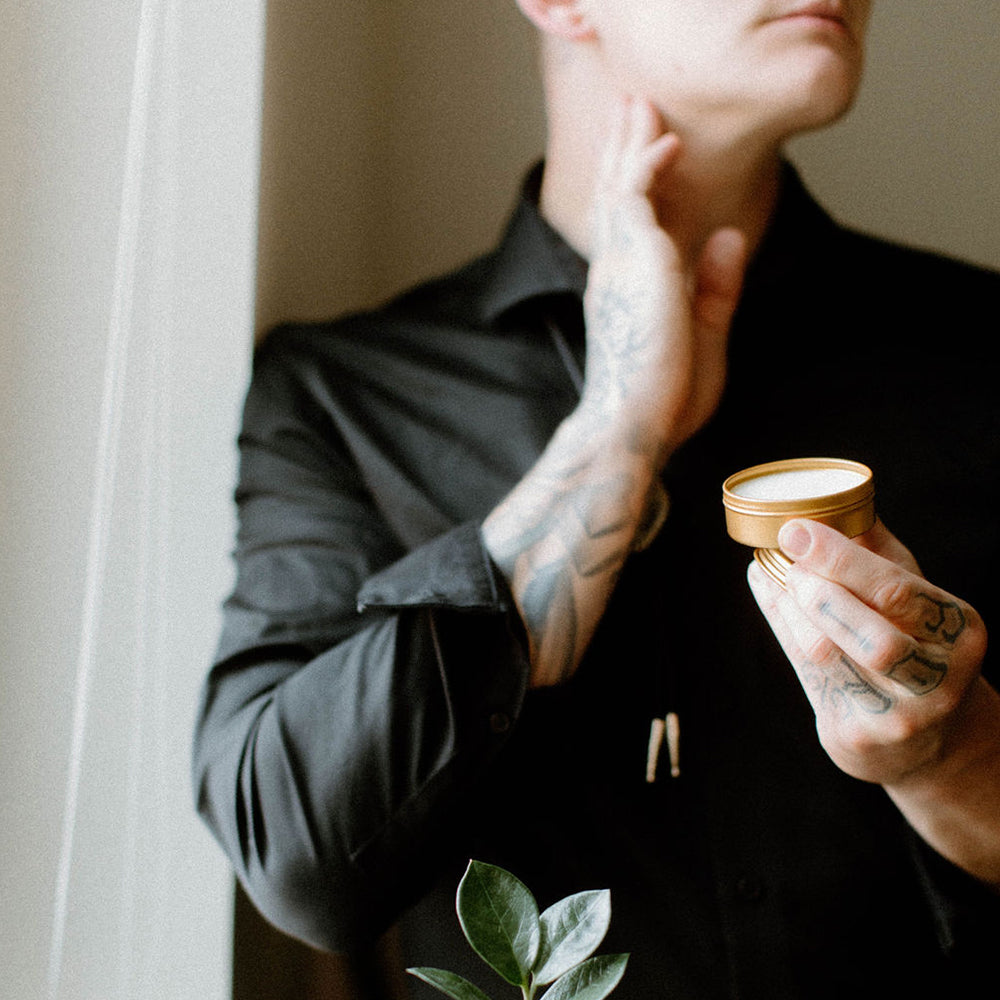Sitka Woodland Solid Cologne being applied by a man. 