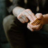 Sitka Woodland Solid Cologne being applied by two hands. 