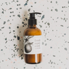 8oz Fresh Squeezed Body Lotion on a speckled countertop. 