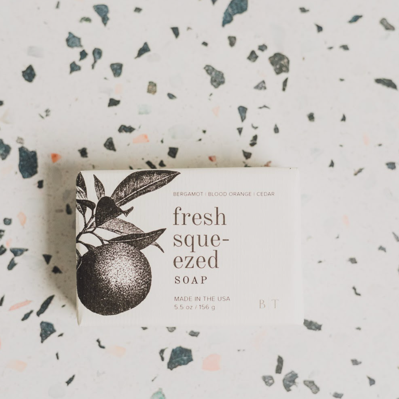 Fresh Squeezed Bar Soap on speckled countertop. 