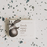 Fresh Squeezed Bar Soap on speckled countertop. 