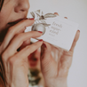 Fresh Squeezed Bar Soap being sniffed by a woman. 