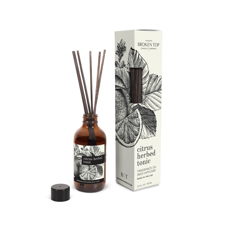 Citrus Herbed Tonic Reed Diffuser on white background. 